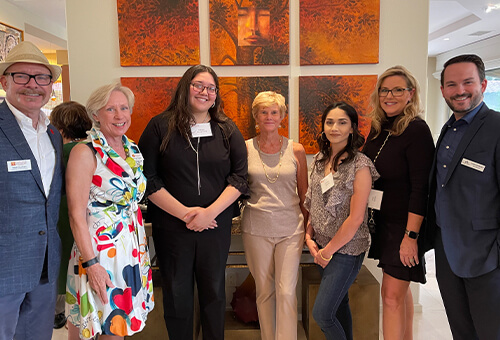 Photo of 7 individuals posing for a photo at an Academic Angels event.