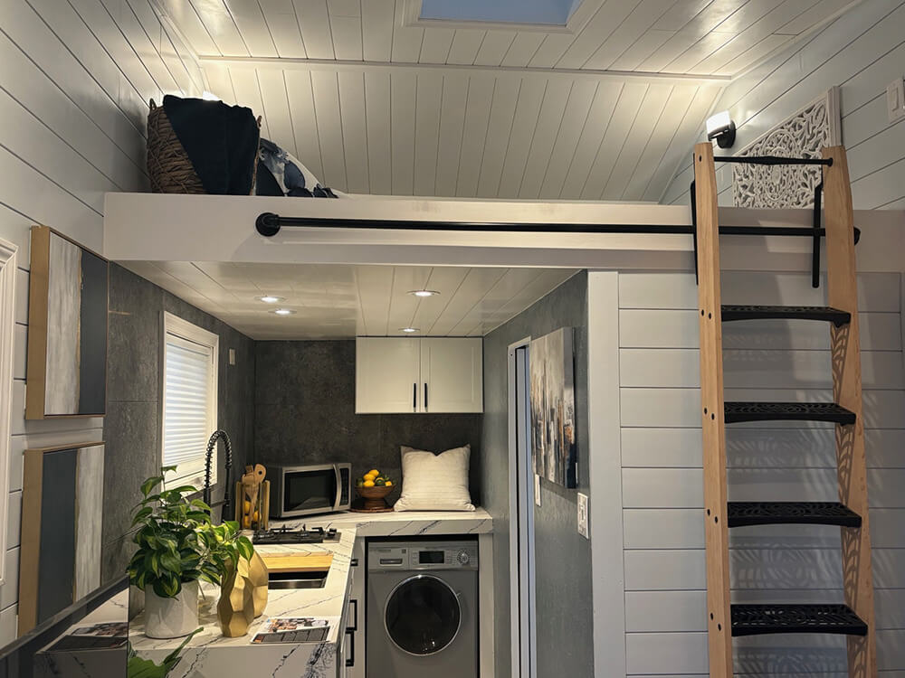 tiny-home-02_1000_opt Photo showing the stairs that lead up to the sleeping area above the kitchen inside the Tiny Home