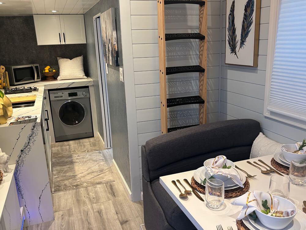 tiny-home-03_1000_opt Photo showing the living room area and kitchen inside the Tiny Home