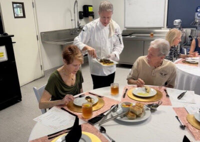 Guests and College of the Desert Culinary Arts students during the President's Circle Culinary Experience, featuring student-prepared meals and chef presentations.