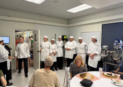 Guests and College of the Desert Culinary Arts students during the President's Circle Culinary Experience, featuring student-prepared meals and chef presentations.