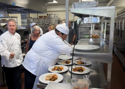 Guests and College of the Desert Culinary Arts students during the President's Circle Culinary Experience, featuring student-prepared meals and chef presentations.